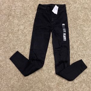 AE American Eagle Black NWT size 00 Next level stretch womens jeans destructed